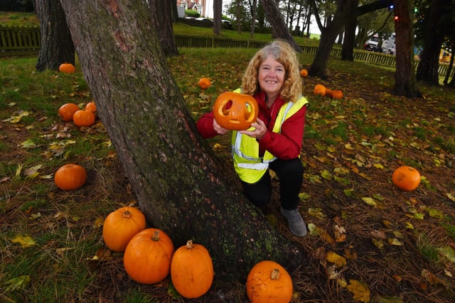 Volunteer Anne Gaskell in the pumpkin patch.