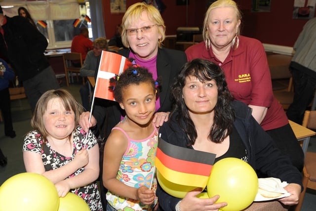 Rebecca Breckell, nine, and Shade Egerton, eight, join their mum Tracey Egerton, along with Julie Mazzola of HT Forrest  and Gwen King (chair of the Queens Park Residents Association) during the European Day at Queens Park Residents Association Community Centre, in Blackpool