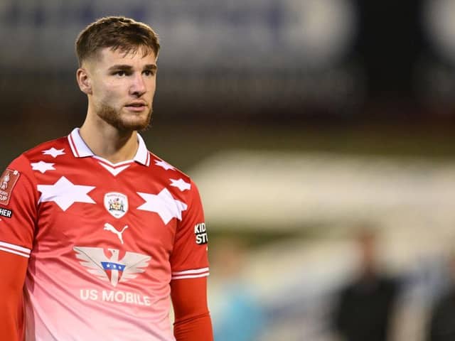Barnsley striker John McAteeis wanted by four Championship clubs. Blackpool's promotion rivals may have to deal with a recall by Luton Town. (Image: Ben Roberts Photo/Getty Images