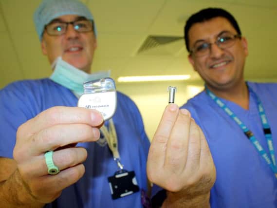 Dr Graheme Goode, left, with the old-style pacemakers and Dr Khalid Abozguia with the new lead-free version