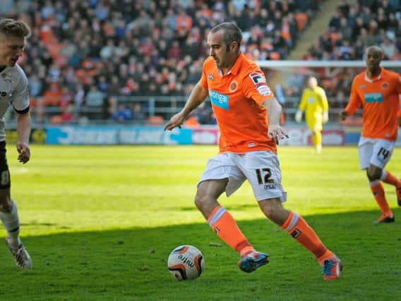 Taylor-Fletcher in action for Blackpool during his playing days