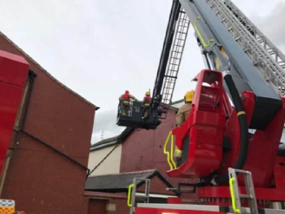 Crews used an ALP to make the building safe