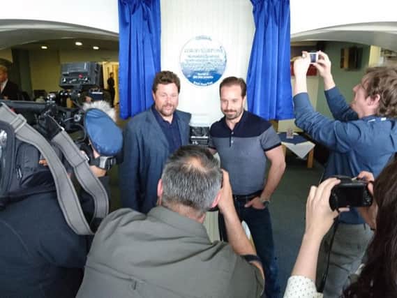 Press surround Michael Ball, left, and Alfie Boe as they reveal the new blue plaque in his honour at Fleetwood's Marine Hall