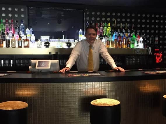 James Howarth behind the bar at Deja Vu which has opened in Poullton