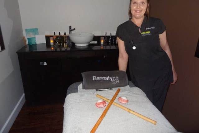 Lyndsey Mcfarlane at Bannatynes spa with bamboo sticks and lava shells which are used in massage
