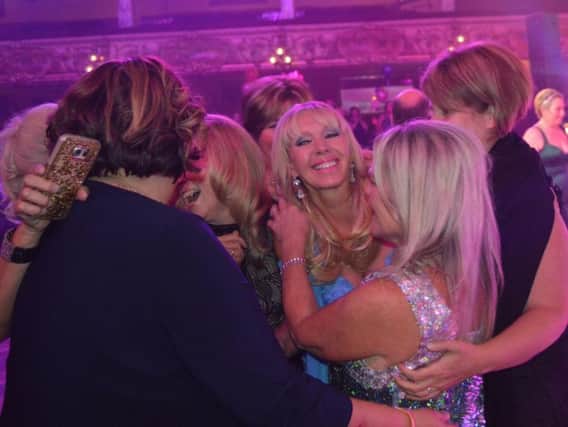 Employee of the Year Louise Thompson is mobbed by her colleagues