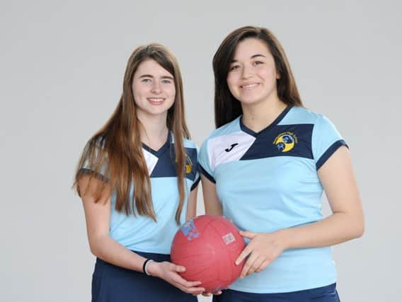 Caitlin Ellis and Sophia Burgess in the new Montgomery netball kit for their Easter tour