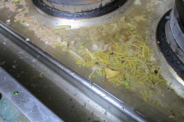 Inspectors found dirt on cooking equipment and shelves at Asia Bagus, in Layton