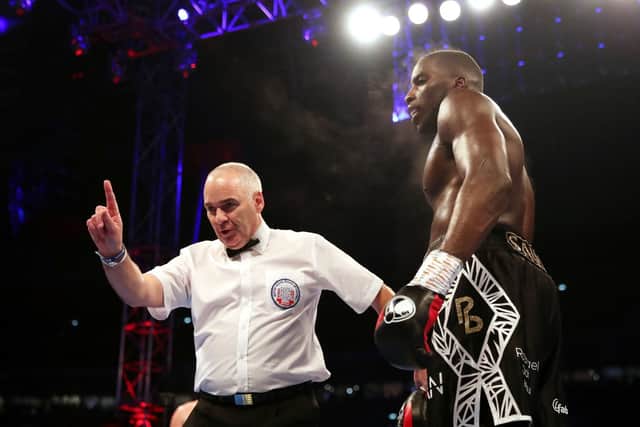 Referee Victor Loughlin takes a point off Okolie
