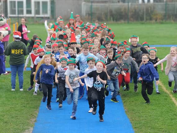 Elf run at Anchorsholme Academy to raise money for Trinity Hospice and Brian House