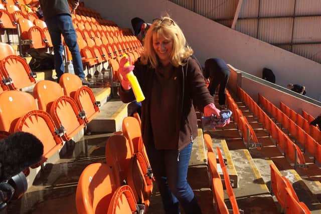 Christine Seddon doing her bit to get the Bloomfield Road stands cleaned up for the homecoming game for exiled supporters