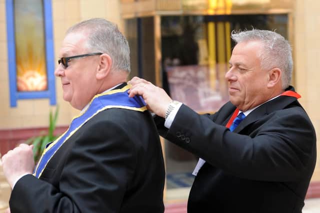 John Topping (right) gives Gordon Cooke a helping hand.