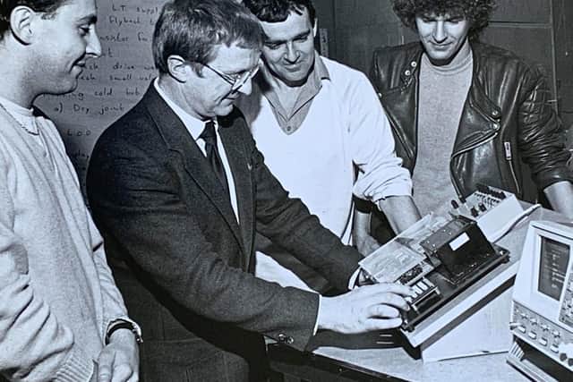Head of information technology John Thorpe using the logic analyser. From left: Jim McGuirk, John Thorpe, Paul Duxbury and John Coleman.