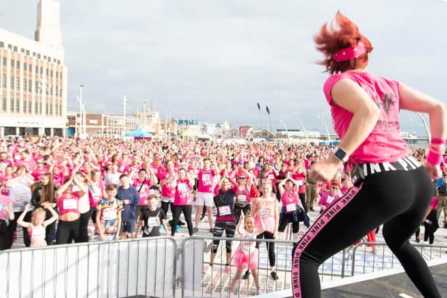 Those taking part get a pre-run warm-up.