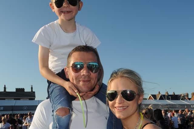 The Osborn family, mum and dad Alex and Jonathan with Sebastian in the best seat in the house.