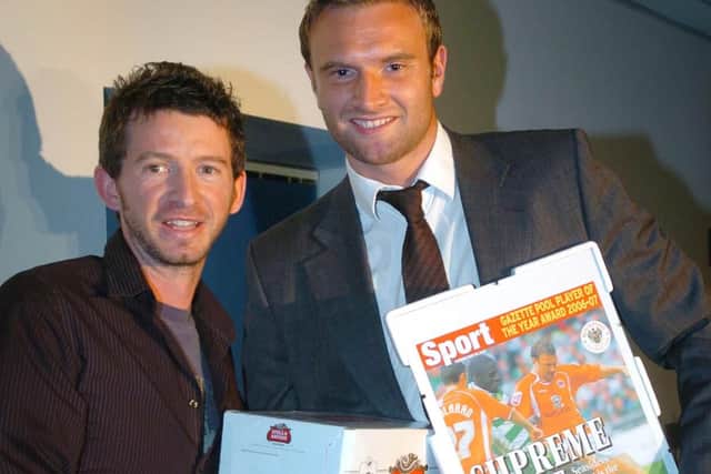 Former Gazette reporter Steve Canavan presents Evatt with his Gazette Player of the Year Award...and some beer!