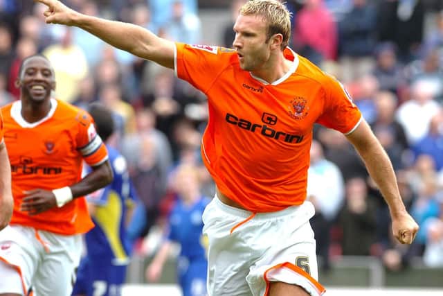 The defender celebrates after scoring against Cardiff City