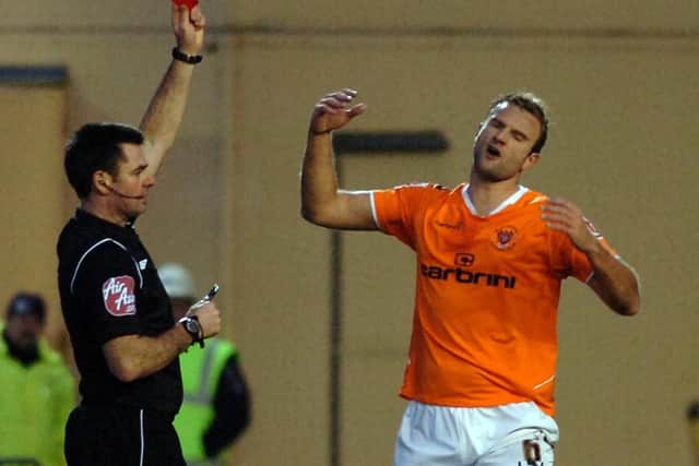 Evatt is shown a red card in an FA Cup game against Ipswich Town