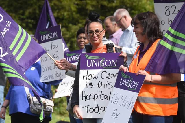Cleaners at Blackpool Victoria Hospital on strike in protest at unfair pay rates.