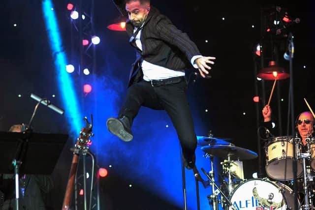 Alfie Boe leaps into action at his Homecoming concert at Fleetwood Town Football Club