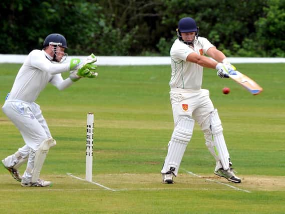 Wicketkeeper Richard Staines takes the ball for St Annes against Chorley