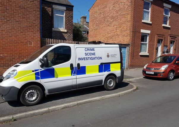 Crime Scene Investigation van and police officers on Inkerman Street, Preston.
