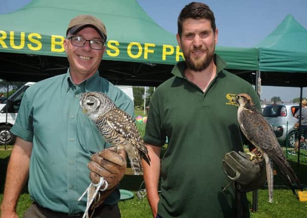 Paul Walters (left) with Otto the Chaco Owl and Jim Sutton with Cleo the Lanner Falcon, all from Horus Birds of Prey.
