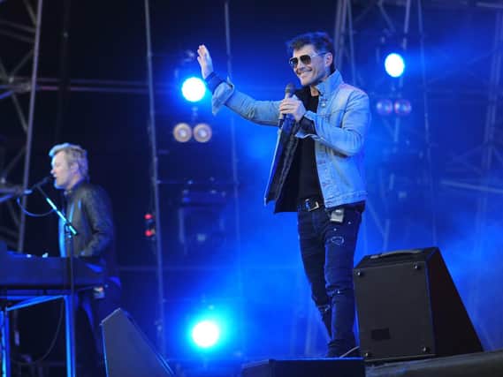 a-ha's Magne Furuholmen and Morten Harket on stage at Bloomfield Road