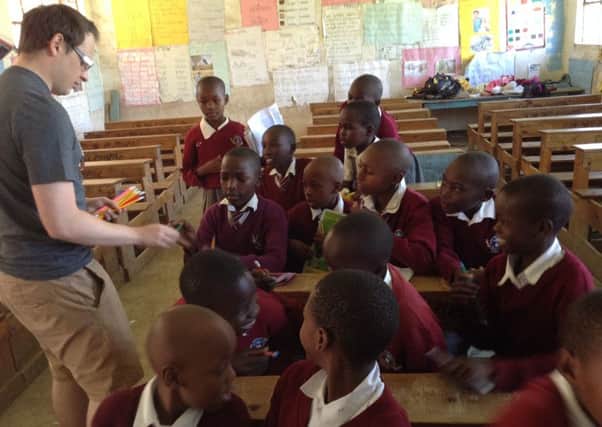 Hawe Side Academy year 3 teacher Ashley Dawson with some of the children at Barat Primary School