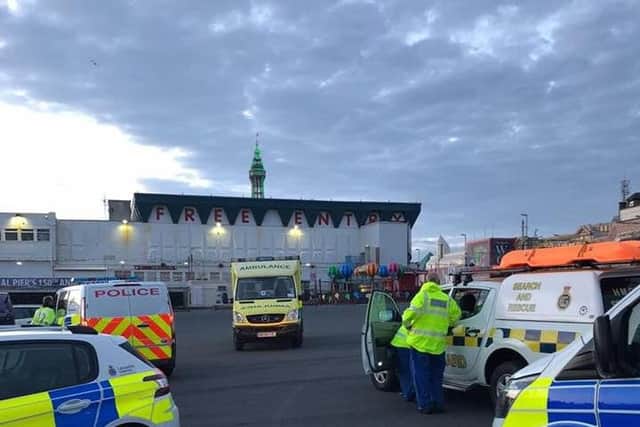 The man was spotted by a member of the public who heroically ran into the sea near Central Pier, pulling the man to safety.