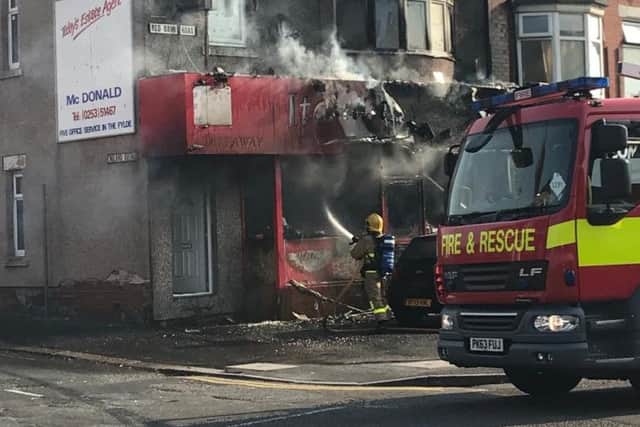 A firefighter was seen hosing down Italian Star, in Red Bank Road, Bispham (Picture by Chelcee Pasquill)