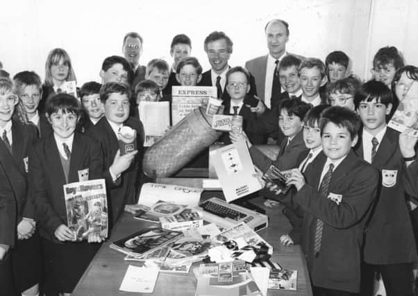 Carr Hill pupils pack a special time capsule, made by GEC Plastics, watched by Fylde MP Michael Jack, before burying it in the school grounds, in 1990.