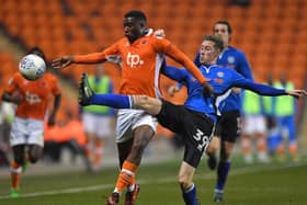 Joe Bunney playing for Rochdale against Blackpool last season