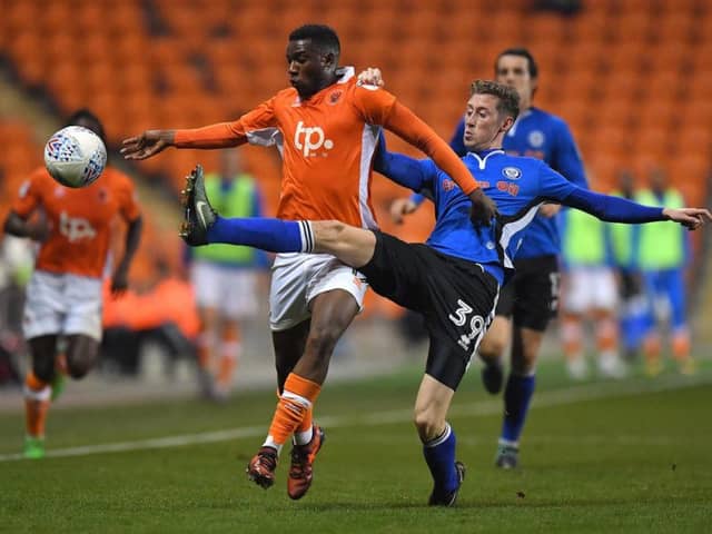 Joe Bunney playing for Rochdale against Blackpool last season