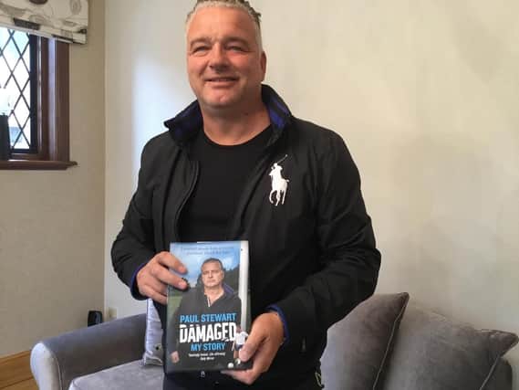 Paul with his book Damaged