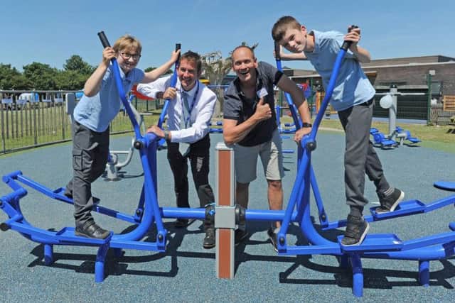 Comedian Steve Royle opens the new outdoors gym at Great Arley School in Thornton.  He is pictured with headteacher Peter Higham and pupils Dalton Fieldhouse and Liam Duffy.