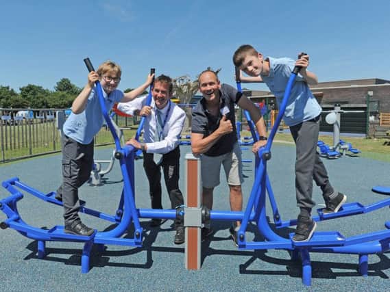 Comedian Steve Royle opens the new outdoors gym at Great Arley School in Thornton.  He is pictured with headteacher Peter Higham and pupils Dalton Fieldhouse and Liam Duffy.