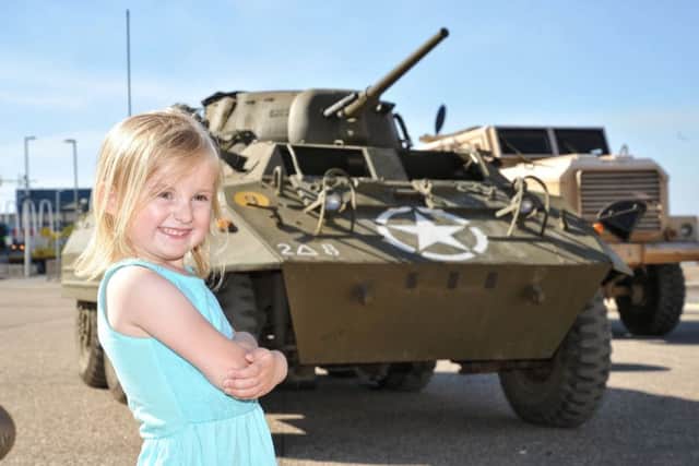 Conni-Mia Yane, four, admires one of the armoured vehicles on display during Blackpools Armed Forces Day celebrations