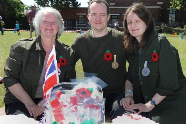 St Bernadette's Catholic Primary School in Bispham held a memorial service and gala day.Crocheted poppies and medals for sale with L-R: Elaine Rushton, Elliot Evans and Gill Dowling.  PIC BY ROB LOCK24-6-2018