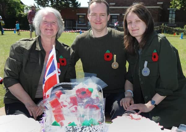 St Bernadette's Catholic Primary School in Bispham held a memorial service and gala day.
Crocheted poppies and medals for sale with L-R: Elaine Rushton, Elliot Evans and Gill Dowling. PIC BY ROB LOCK
24-6-2018