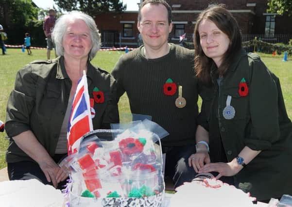 St Bernadette's Catholic Primary School in Bispham held a memorial service and gala day.
Crocheted poppies and medals for sale with L-R: Elaine Rushton, Elliot Evans and Gill Dowling.  PIC BY ROB LOCK
24-6-2018