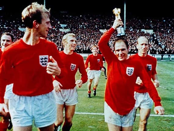 Ray Wilson with the Jules Rimet trophy flanked by the Charltons, Jack and Bobby, with George Cohen, Bobby Moore and Alan Ball behind