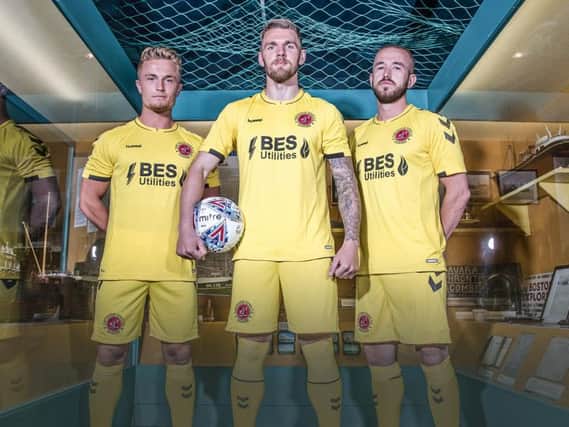 Fleetwood will debut their new away kit at Salford City tonight. Kyle Dempsey, Ash Eastham and Paddy Madden model the kit in the Fleetwood Museum