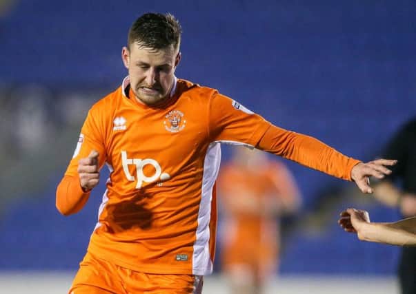 Blackpool striker Scott Quigley has joined Port Vale on loan