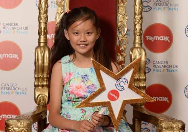 Courageous  school girl Alyssa Davies, aged 11, who has been treated for cancer, shines at the Cancer Research UK Kids & Teens Star Awards party held in partnership with TK Maxx at the Bloomsbury Ballroom in London on Tuesday 10 July 2018.