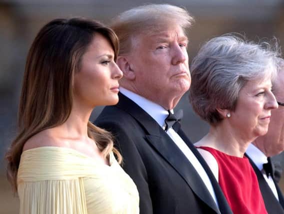 US President Donald Trump and his wife Melania stand with Prime Minister Theresa May and her husband Philip May