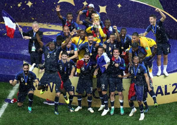 France celebrate winning the World Cup in the rain