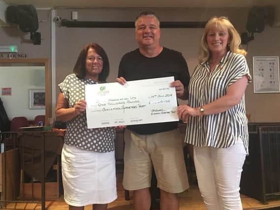 Paul Stewart receives the cheque on behalf of SAVE from BST committee members Pauline ORourke (left) and Christine Seddon