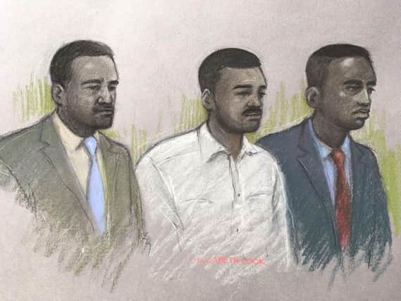 Court artist sketch by Elizabeth Cook of (left to right) Merse Dikanda, Jonathan Okigbo, and George Koh at The Old Bailey, London where they are on trial accused of the murder of 25-year-old Harry Uzoka from west London. Photo credit: Elizabeth Cook/PA Wire