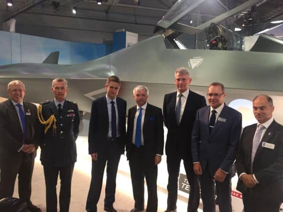 Mark Menzies, centre, with Gavin Williamson, to his right, at Farnborough for the announcement of the 2bn for future aircraft development